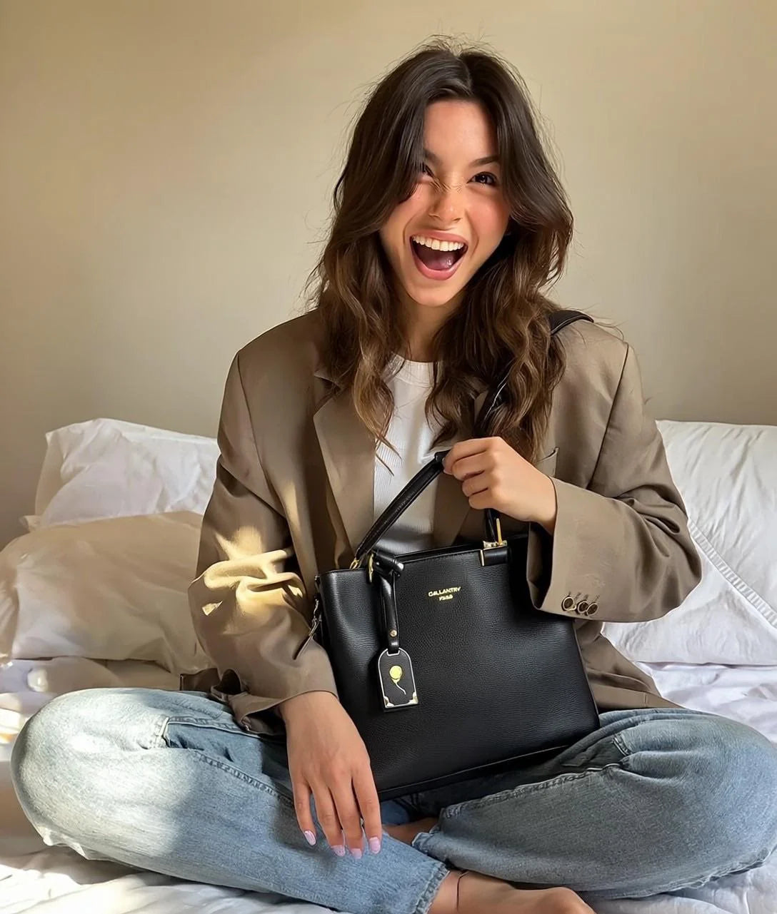A picture of an influencer holding the La Sophia handbag of Gallantry 